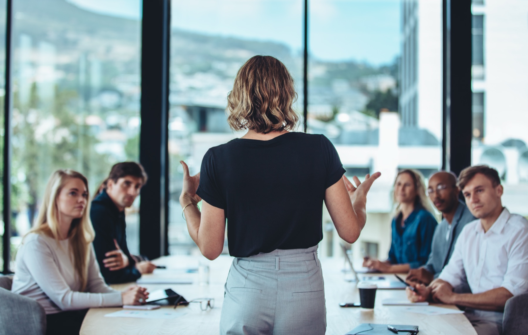A marketing leader guiding her team through a meeting